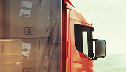 Close up image of a semi truck carrying packages